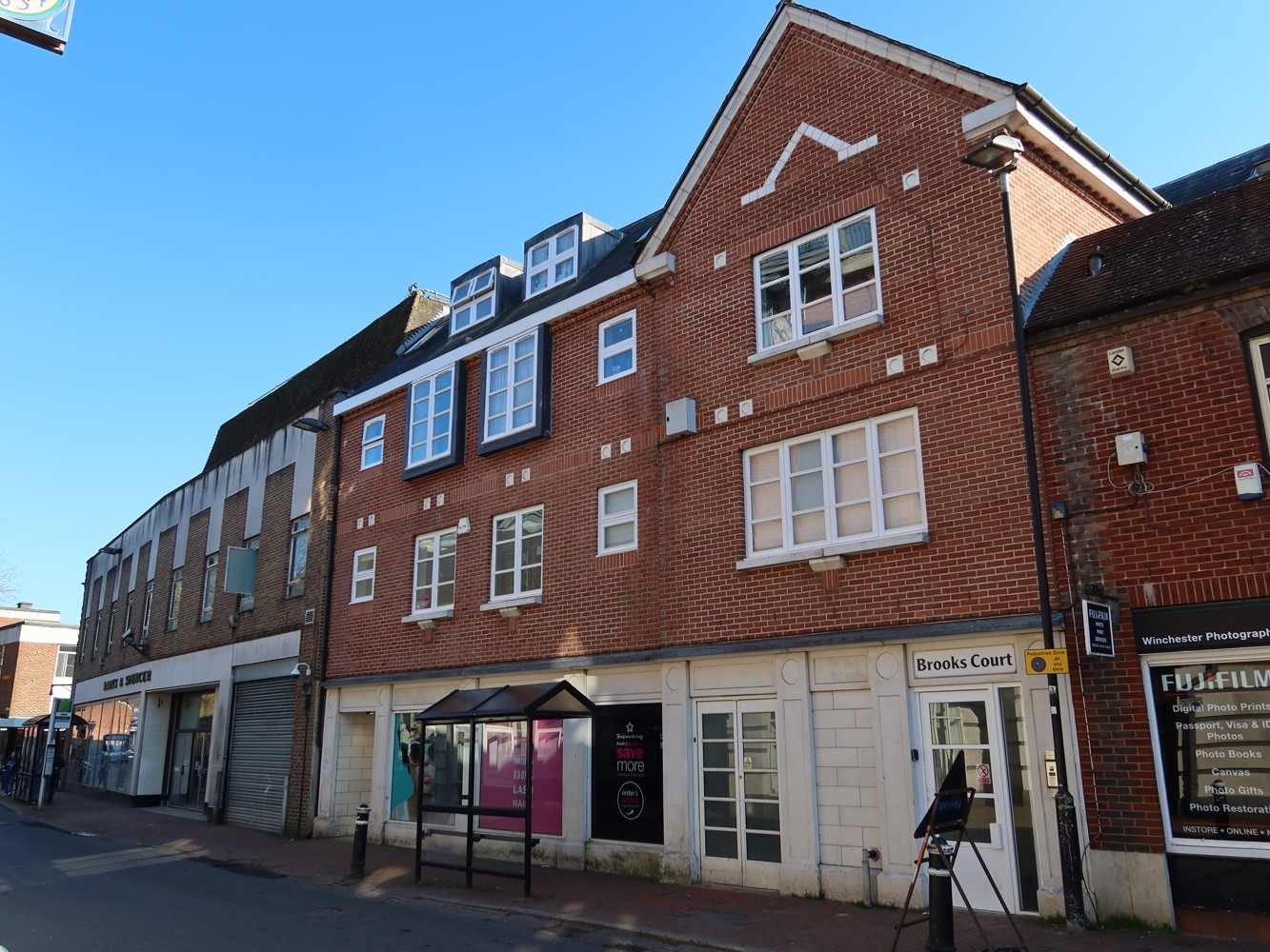 Mixed retail and residential premises in central Winchester.